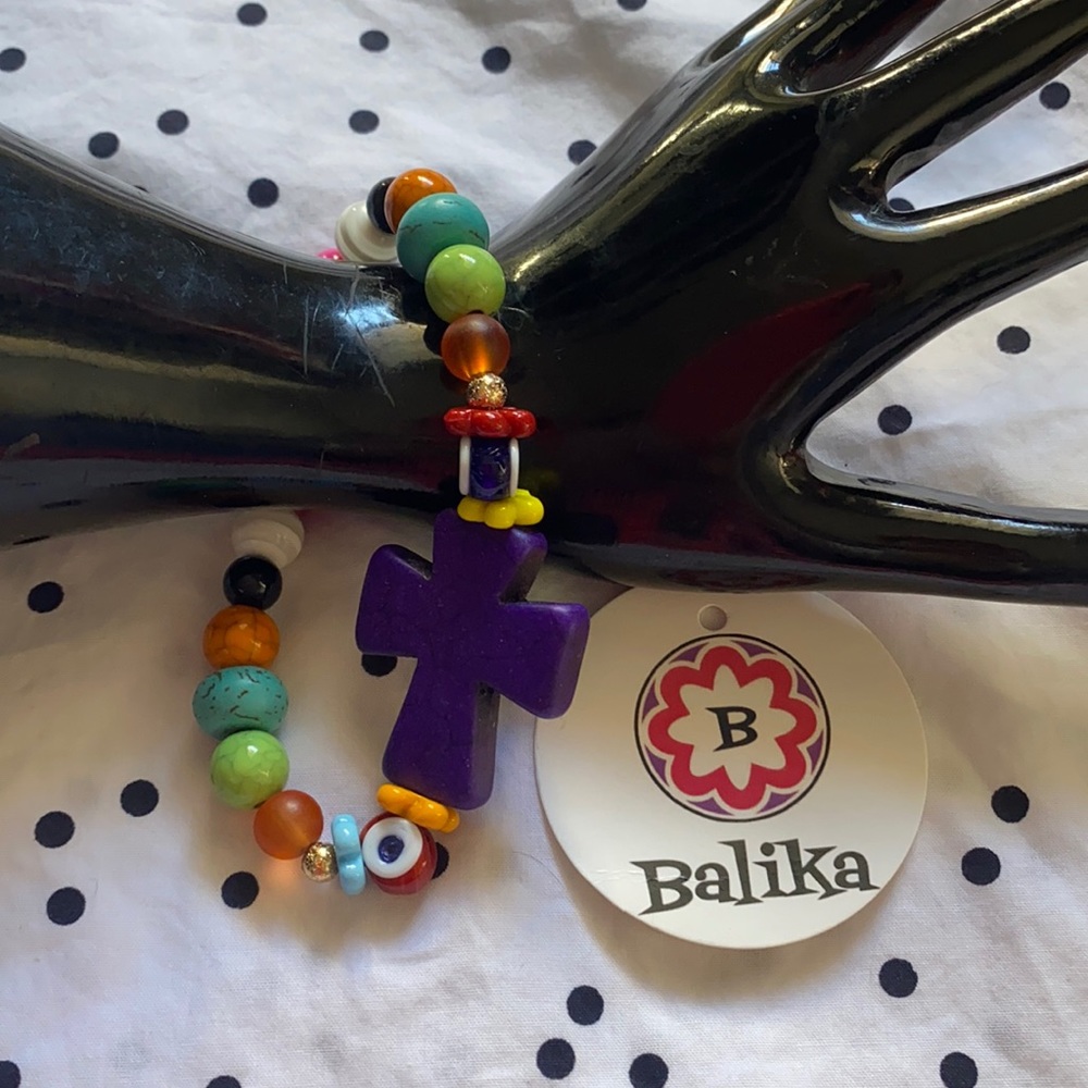 Handcrafted beaded bracelet. Multi color with purple cross/evil eyes